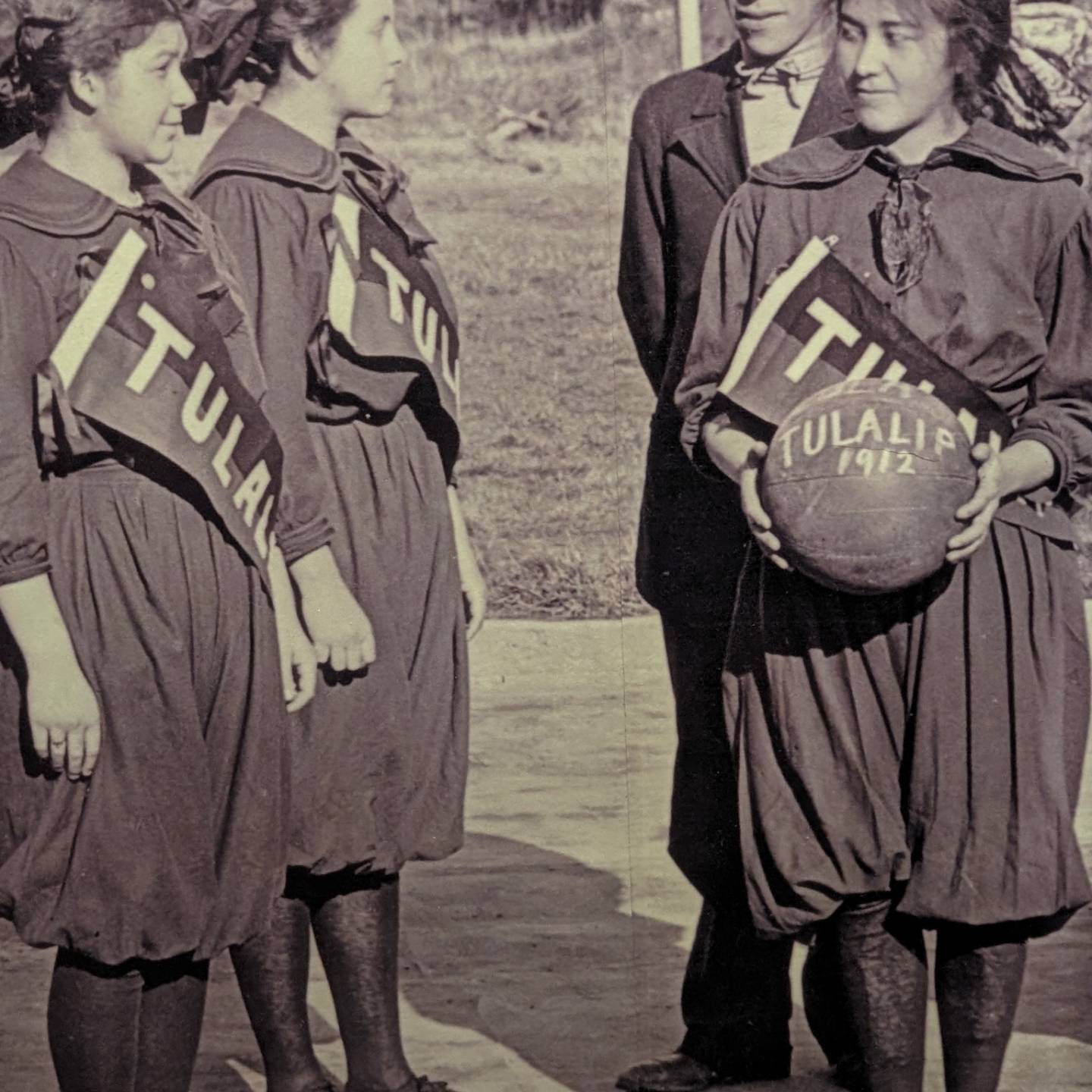 Native girls with a basketball at a boarding school